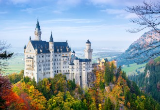 Picturesque autumn view of the Neuschwanstein castle. 19th-century Romanesque Revival palace near Füssen in southwest Bavaria, Germany. The famous popular tourist attraction of Europe